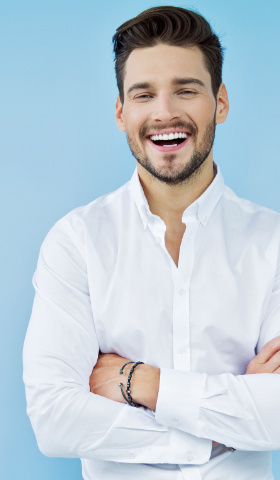 Man smiling on blue background
